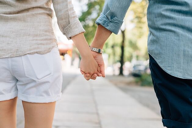 A man who does not have a potency problem takes a woman's hand
